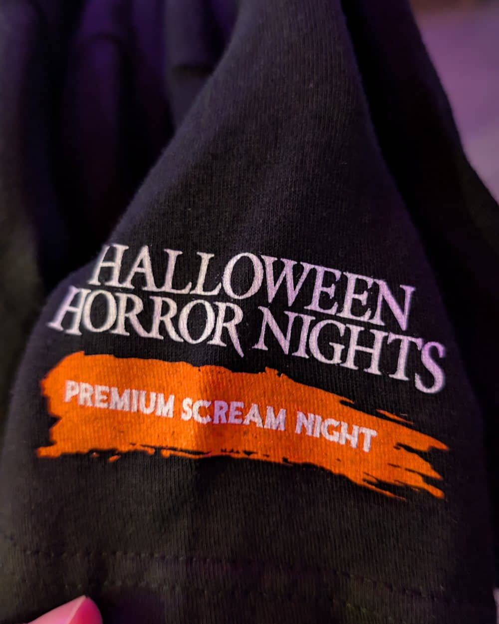 The Premium Scream Night logo on the sleeve of the exclusive t-shirt