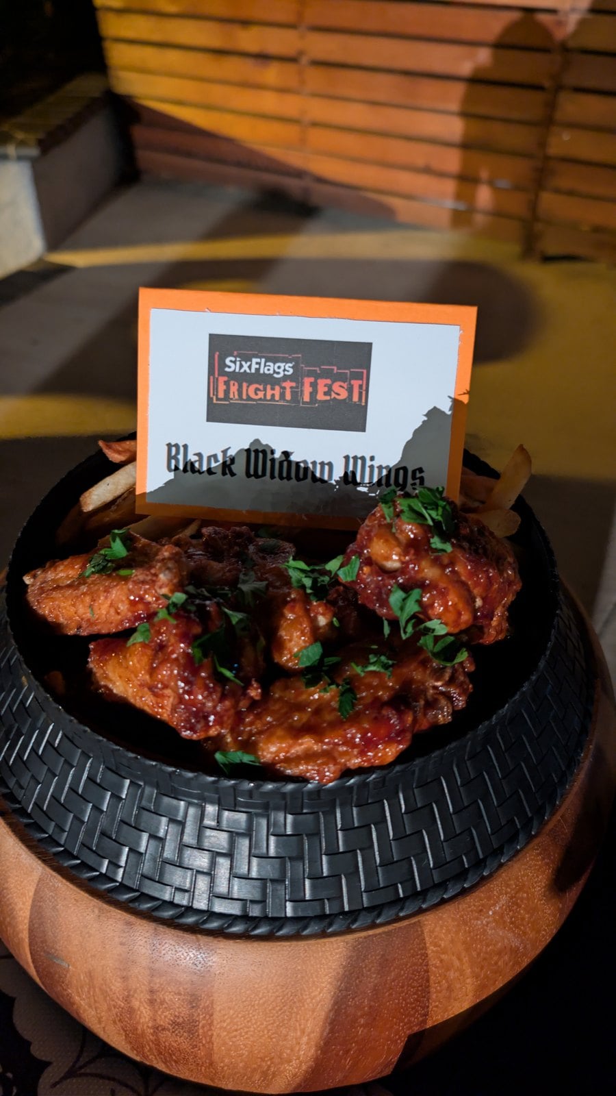 Black Widow Wings in chipotle blackberry sauce with a Six Flags Fright Fest card
