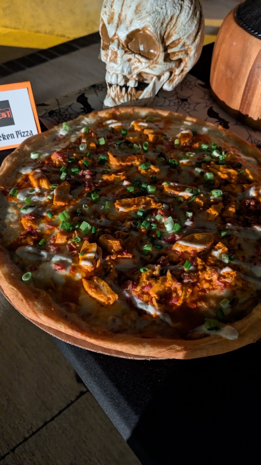 Boo-falo Chicken Pizza with buffalo chicken, bacon, and green onions