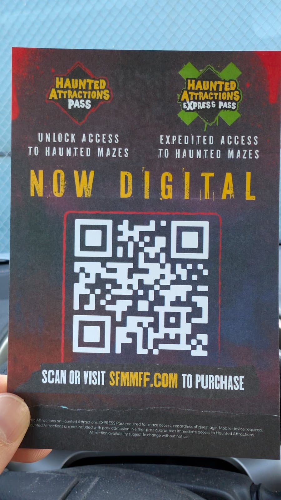 Six Flags Magic Mountain card announcing the Haunted Attractions Pass and Express Pass are now digital, with a QR code to sfmmff.com