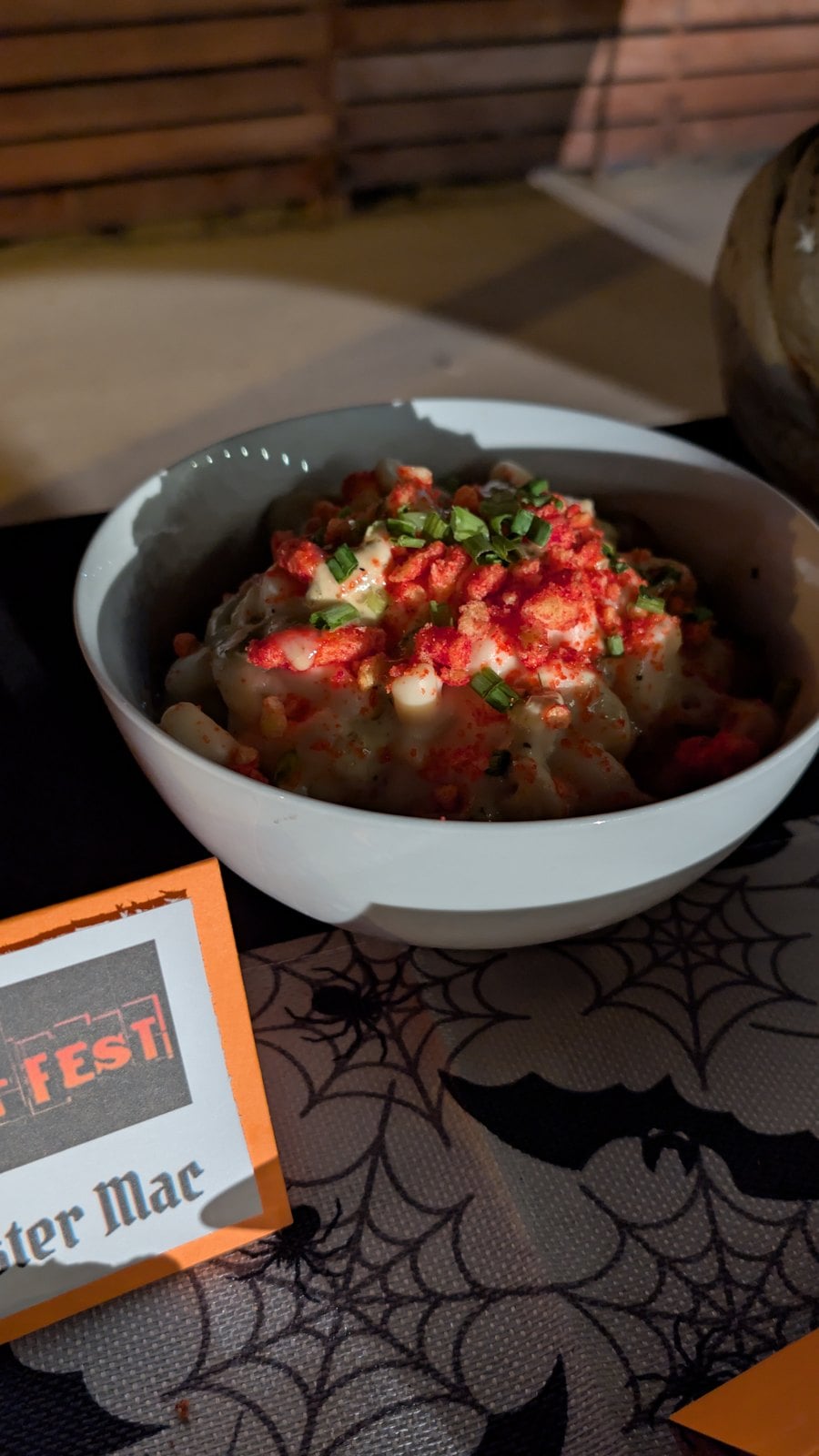 Monster Mac, white mac and cheese topped with Flamin' Hot Cheetos, green onions, and ranch