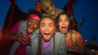 Guests scared by monsters at Fright Fest at Six Flags Magic Mountain