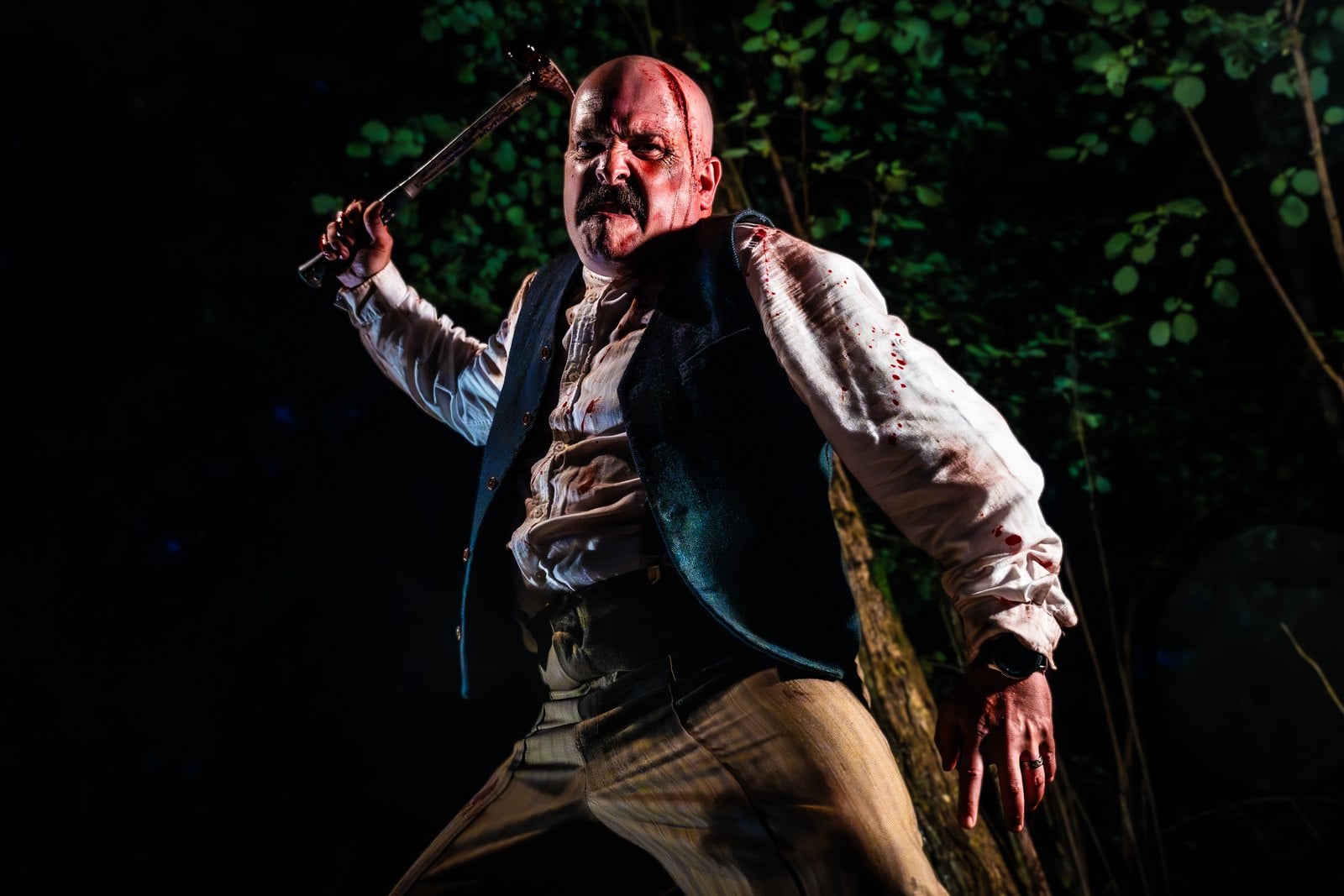 A bloodied scare actor wielding a hammer at Appleton County Farm, a new-for-2026 haunt at Tulleys' Shocktober Fest