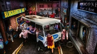 Costumed scare actors and a milk float in the Doom Town street scene at Tulleys Farm's Shocktober Fest