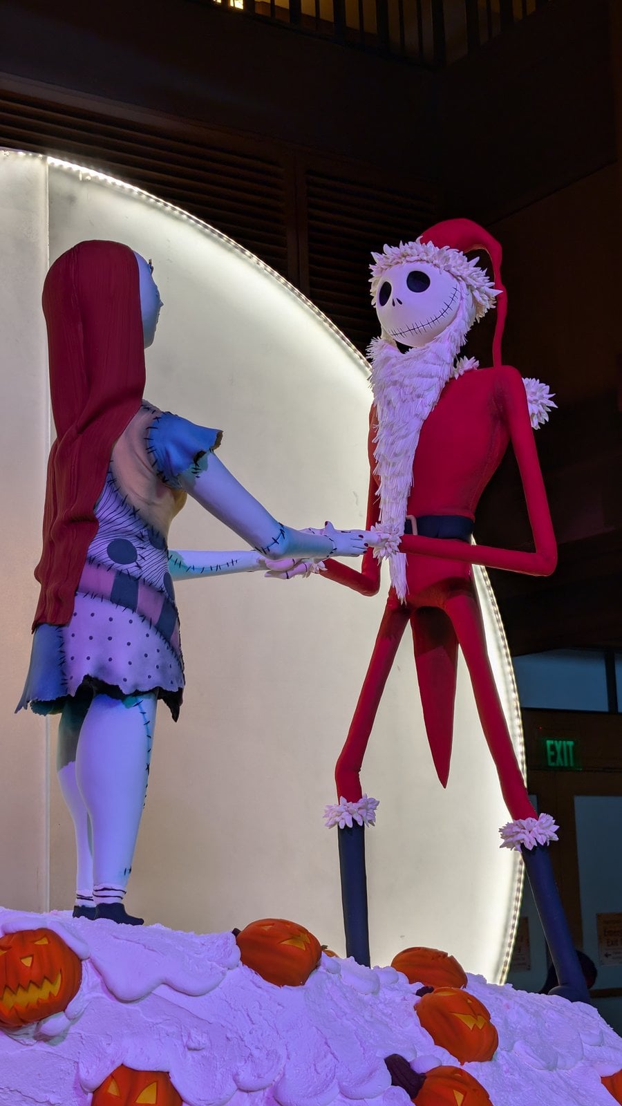 Fondant Jack Skellington in his Sandy Claws suit and Sally on Spiral Hill