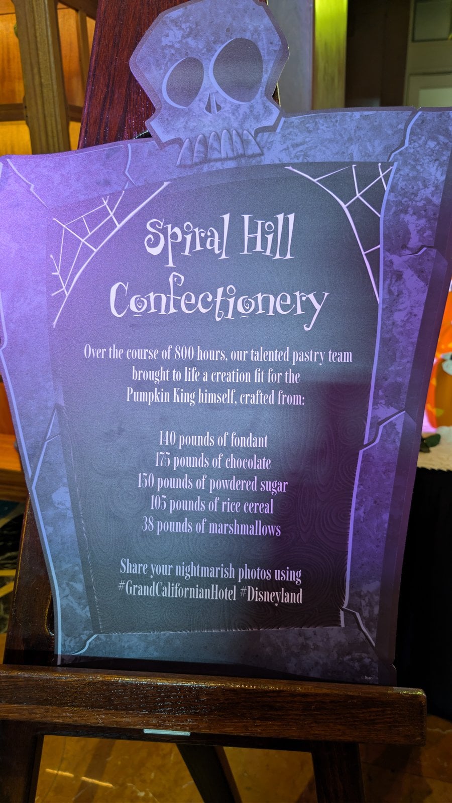 The Spiral Hill Confectionery sign listing 800 hours and the pounds of fondant, chocolate, and sugar used