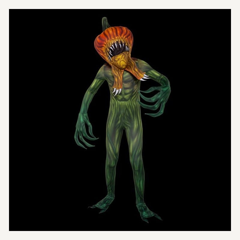 A child in a green printed bodysuit and a pumpkin-headed monster mask with a gaping mouth