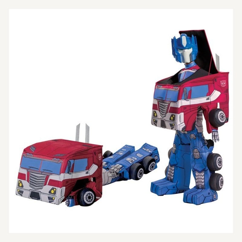 An Optimus Prime child costume shown standing as a robot beside its semi-truck configuration