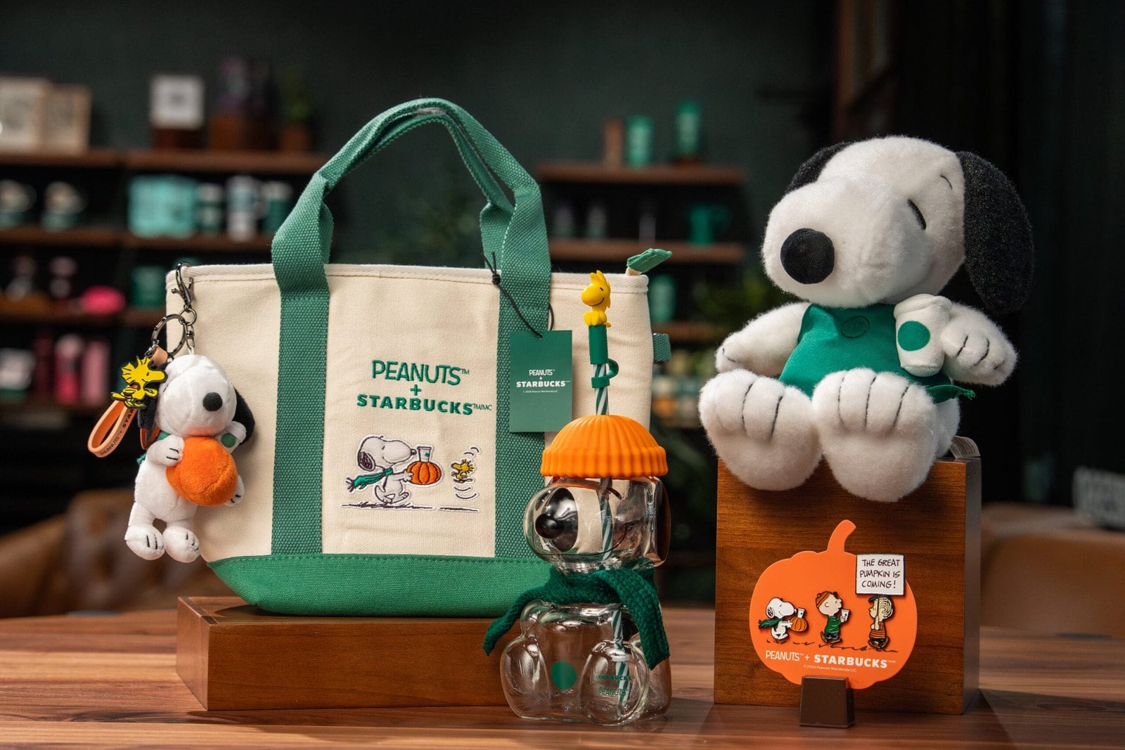Starbucks and Peanuts accessories: Snoopy plush, canvas mini tote, and Snoopy bag charm