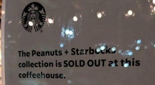 Starbucks in-store sign reading The Peanuts + Starbucks collection is SOLD OUT at this coffeehouse