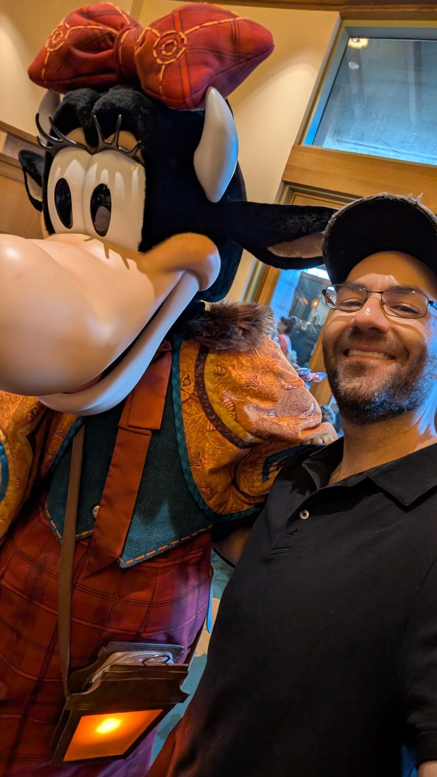 Clarabelle Cow in her fall outfit at her Enchanted Halloween Dinner, with Philip Hernandez