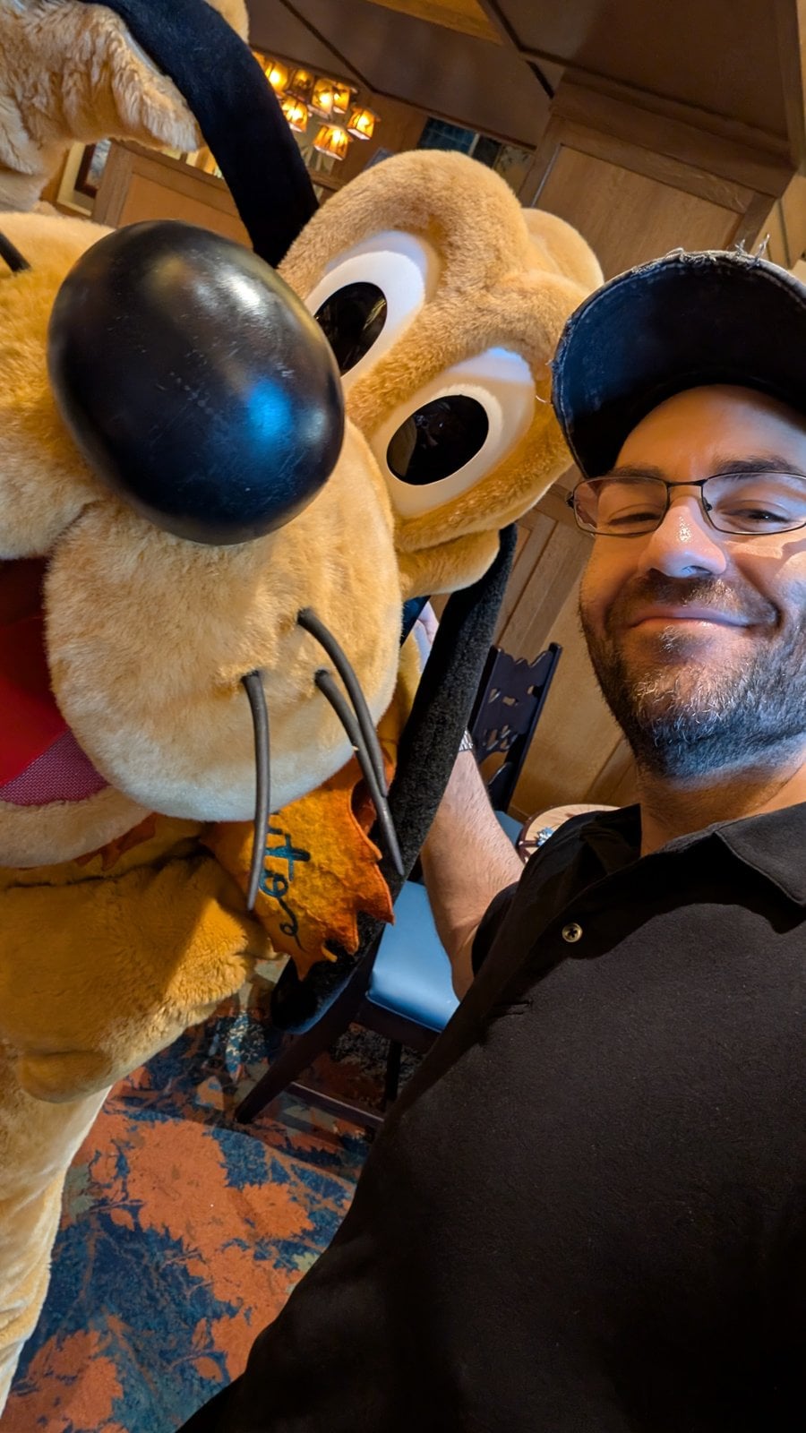 Pluto in his fall outfit at Clarabelle's Enchanted Halloween Dinner, with Philip Hernandez