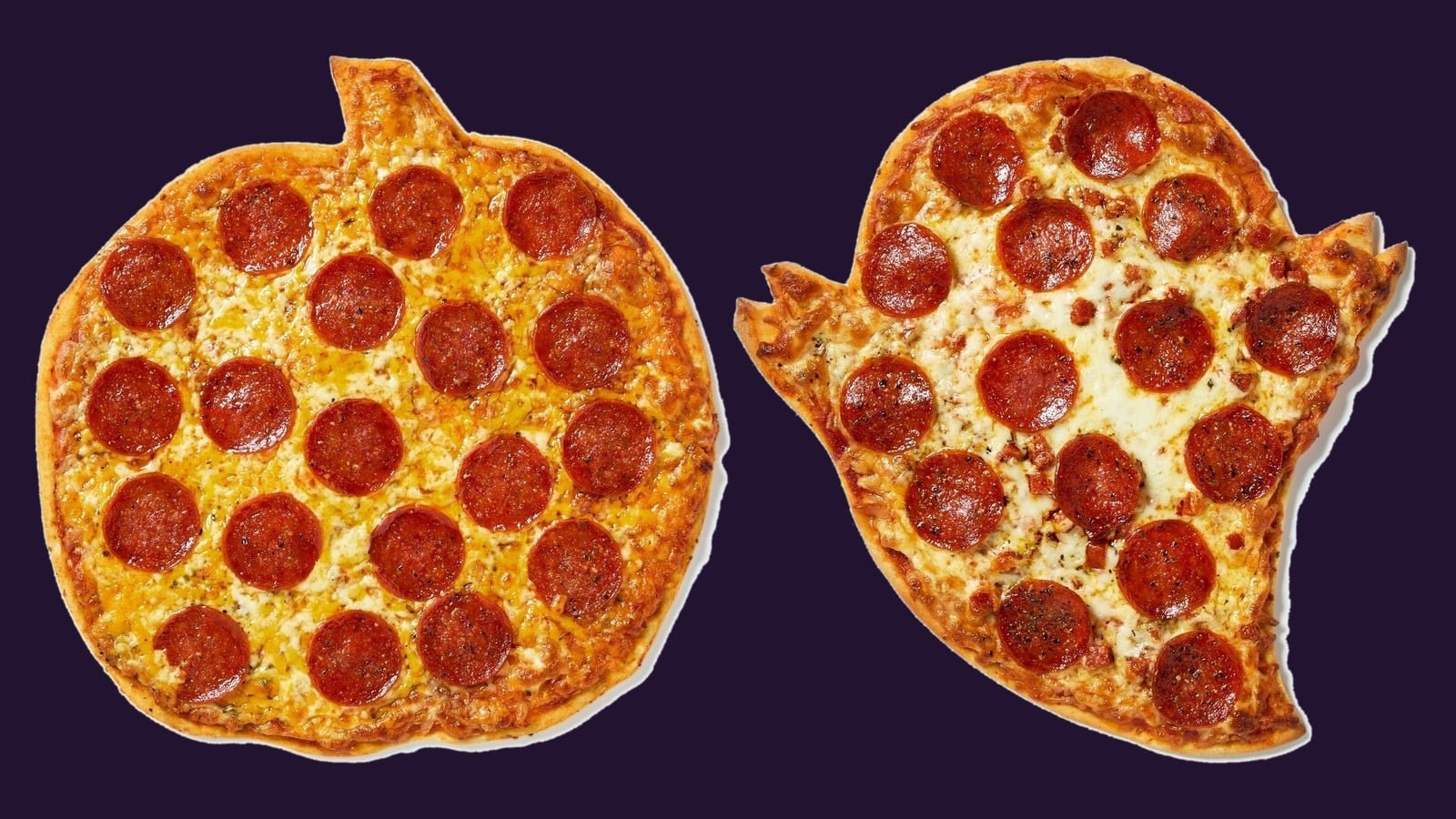 A pumpkin-shaped pepperoni pizza and a ghost-shaped pepperoni pizza on a dark background