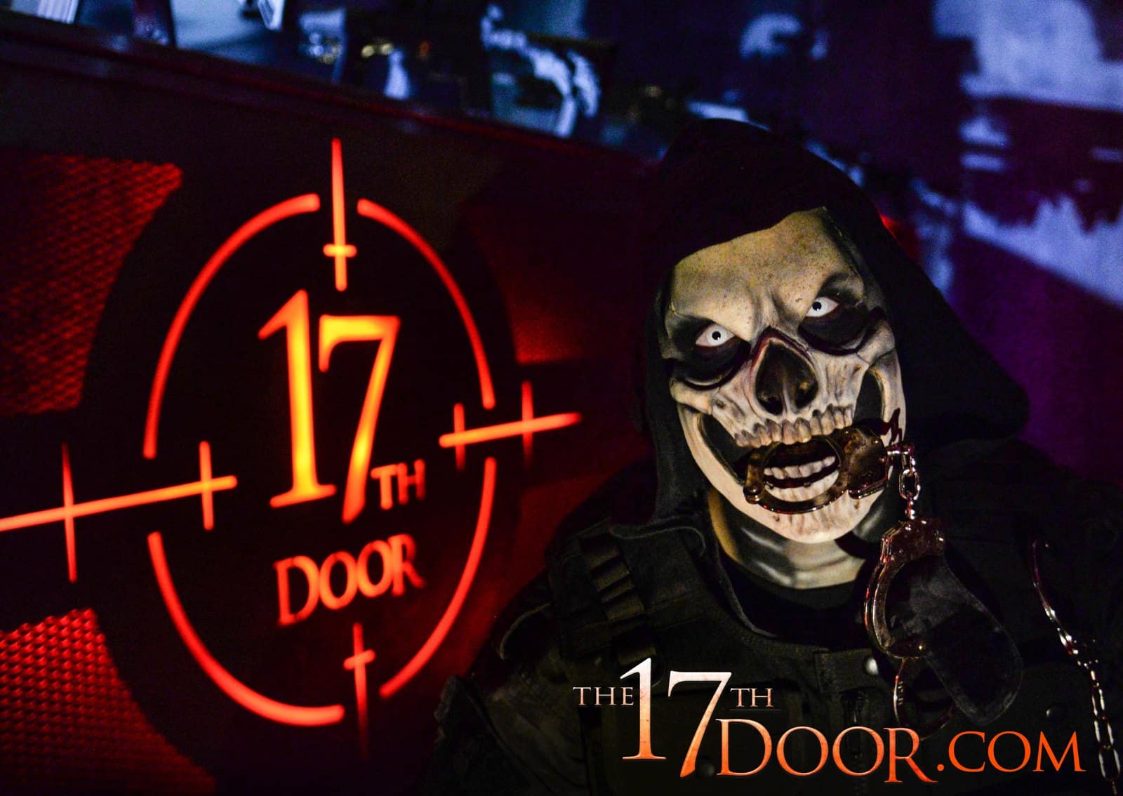 A hooded character in a skull mask holds handcuffs in his teeth beside a glowing red crosshair sign reading 17th Door