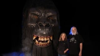 Distortions Unlimited Kong animatronic gorilla head with Ed and Marsha Edmunds standing beside it for scale