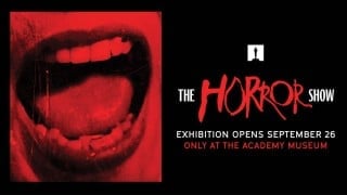 The Horror Show exhibition promo artwork with vampire mouth graphic