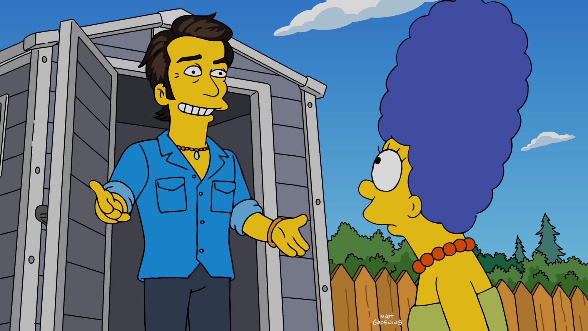 An animated Marge Simpson stands outside a backyard shed as a smiling man in a denim shirt steps out of it