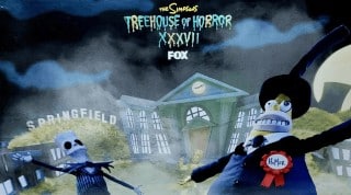 Stop-motion Bart Simpson as Jack Skellington and Homer as the Mayor of Halloween Town in front of Springfield's town hall, under the Treehouse of Horror XXXVII logo