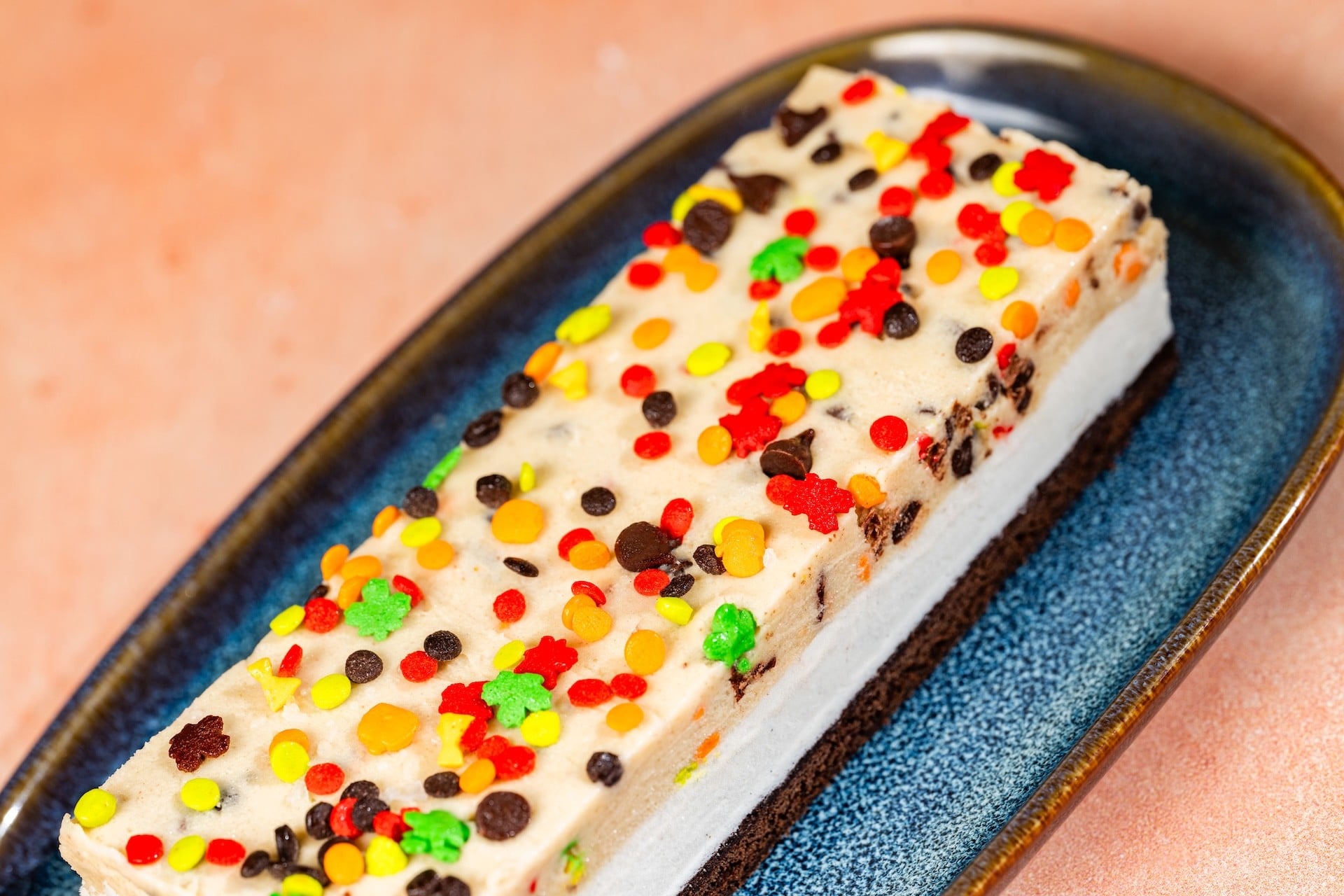 Fall Ice Cream Cookie Dough Sandwich covered in fall sprinkles and chocolate chips